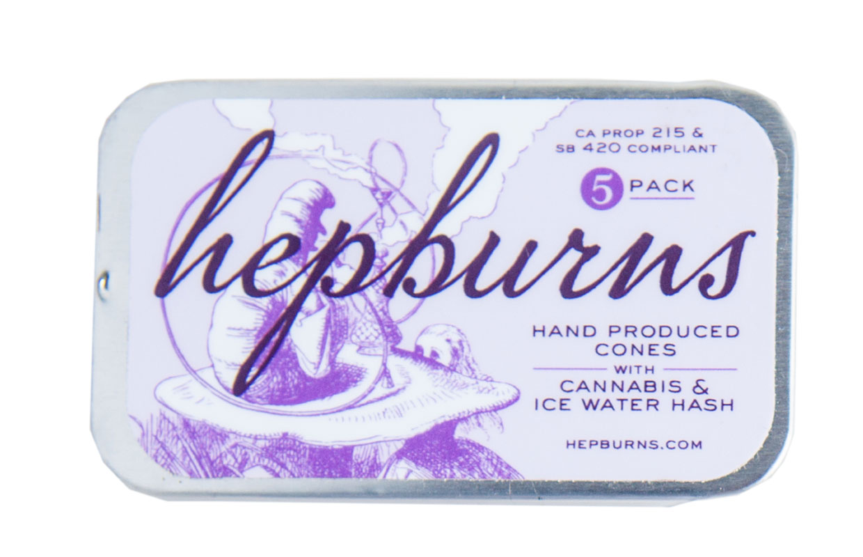 A small tin with elegant print labels it as a box of Hepburns pre-rolled joint.
