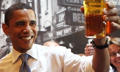 President Obama holding a pint of his favorite beer, Yuengling Lager.