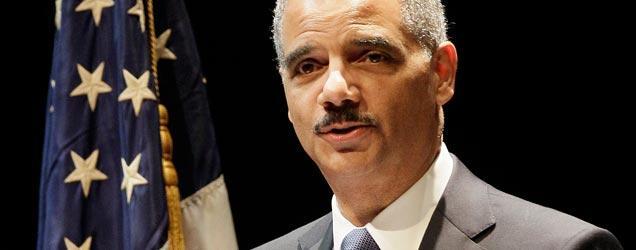 Former AG Eric Holder stands by an American flag as he assures his public that an answer to marijuana is coming.