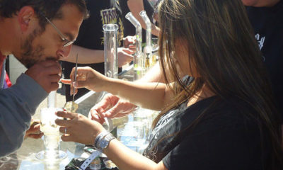 A customer takes a sample dab at the Cannabis Cup in northern California