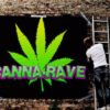 A man pastes up poster for Denver's first Canna-Rave.