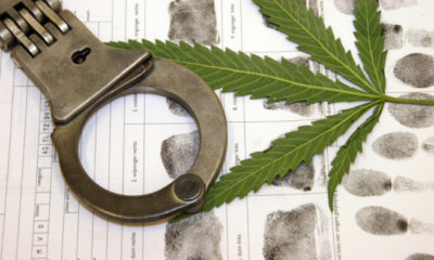 Handcuffs, fingerprints, and a pot leaf near one another represent the lighter sentencing former AG Eric Holder is enforcing for low level drug offenders.