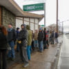 Hundreds of customers wait in line at The Green Solution in Denver to open its doors Wednesday January 1, 2014. Colorado is the first state in the U.S. to allow recreational use of cannabis to adults over the age of 21. Photo by Courtland Wilson/ Cannabis Now Magazine