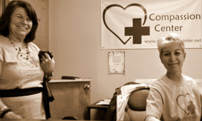 Receptionists sit at their desks at the Compassion Center in Eugene OR.