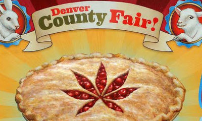 A sign with a cherry pie with a pot leaf cut out decoration. Above the pie the sign reads Denver Country Fair!