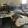 Tables hold all items from a raid by the DEA, they include guns, money, marijuana, and other items.