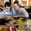 Jennifer May builds a puzzle with her son, Stockton, in Pleasant Grove, Utah. Stockton suffers from debilitating seizures that keeps him from going to a full day of school and has severely stunted his development to that of a toddler. May is leading a push to draft a measure to be introduced in the Utah legislature that would allow her to bring back a liquid form of medical marijuana from Colorado that is working for children with the same syndrome.