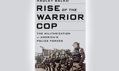 Police officers line the cover of Radley Balko's book "Rise of the Warrior Cop."