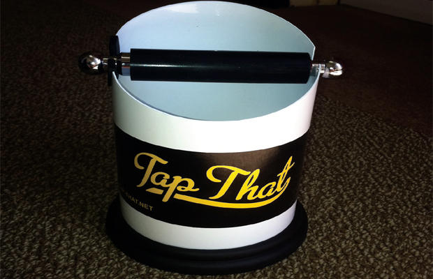 A white Tap That ashtray with the iconic bar across the top.
