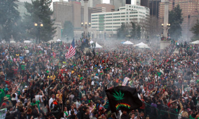 Crowds in a haze of smoke celebrate the first legal 4/20 in Denver.