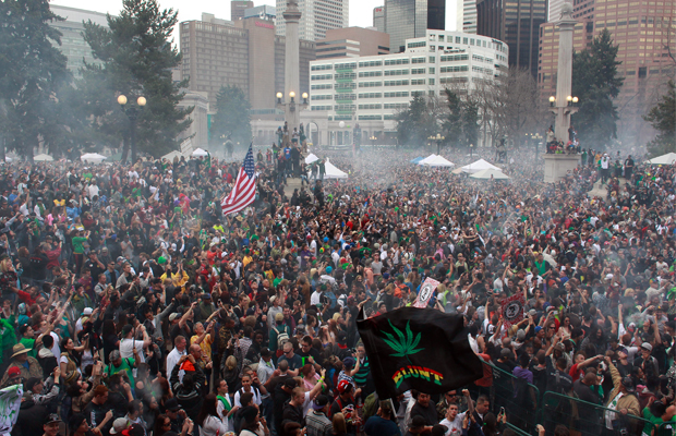 Crowds in a haze of smoke celebrate the first legal 4/20 in Denver.