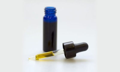 A blue tincture bottle full of CBD oil next to a half full dropper is now the only form of marijuana legal in Missouri.