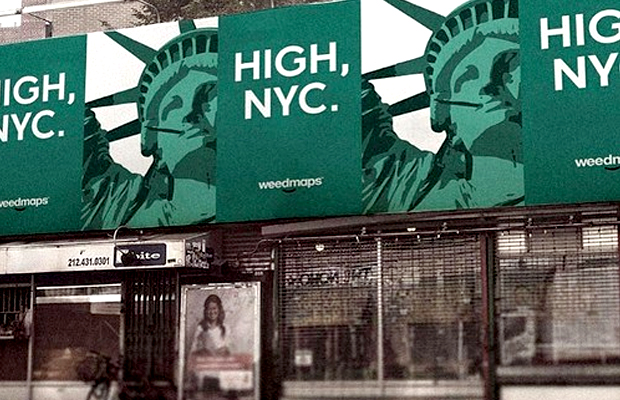 A green billboard in NYC shows the Statue of Liberty with the tag line "High NYC" was pulled at the last second by lawyers.