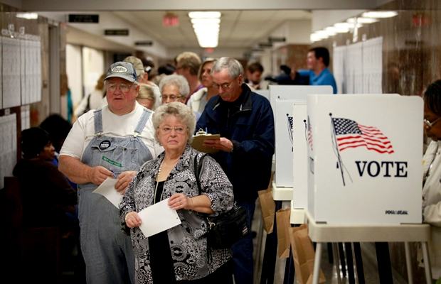 Residents wait in line to pick up a ballot during early voting at the Black Hawk County Courthouse in Waterloo, Iowa.