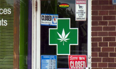 Closed signs cover a dispensary door in south California where local bans have forced them to close their doors.