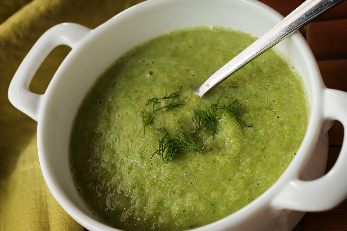 A bowl of bright green asparagus soup infused with Jack Herer canna-oil.