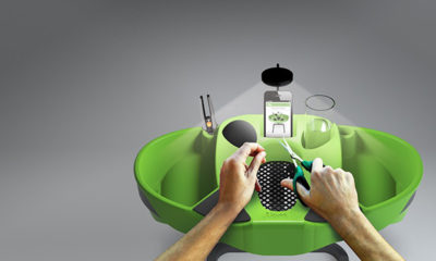 Green Trim Station with a light, drink holders, two catch alls on either side and a grate at the front.
