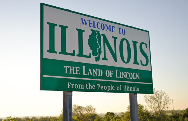 A green and white billboard welcomes visitors to Illinois, where legislators hope to decriminalize marijuana.