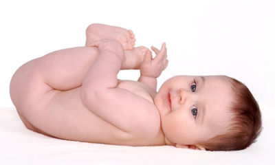 A very healthy newborn poses for a picture on a white background, even though his mom smoked marijuana while pregnant.