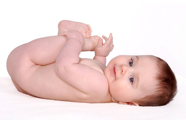 A very healthy newborn poses for a picture on a white background, even though his mom smoked marijuana while pregnant.