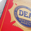 A red DEA special agent truck is parked.