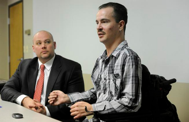 Brandon Coats, right, a quadriplegic medical marijuana patient, along with his attorney, Michael Evans, talks about Coats' case.