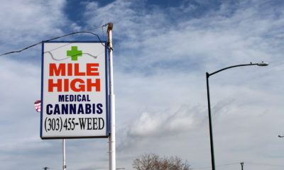 A street sign directs patients and customers to the Mile High Medical Cannabis Club near Denver, CO.