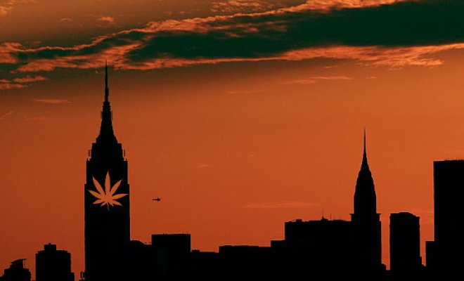 A sunset skyline of NYC shows a pot leaf on the Empire State Building as New York looks to legalize medical marijuana.