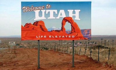 A sign in the middle of the desert welcomes visitors to Utah where the nation's first CBD law goes into effect.