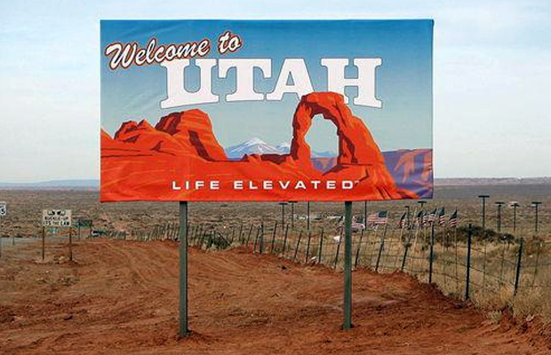 A sign in the middle of the desert welcomes visitors to Utah where the nation's first CBD law goes into effect.