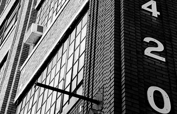 Black and white picture of the number 420 on the side of building in Minnesota
