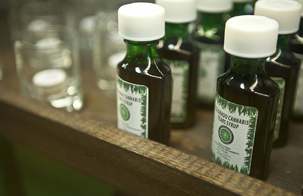 Little green bottles filled with cannabis tears syrup