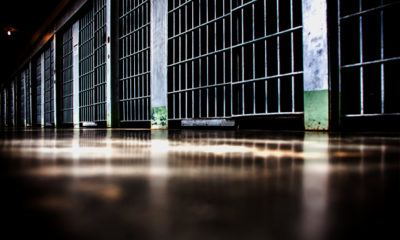 Prison cells line a hallway at a federal prison where Scarmazzo, a rapper and legal dispensary owner, is doing time for owning a legal operation.