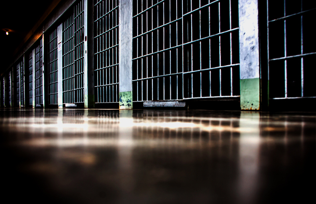 Prison cells line a hallway at a federal prison where Scarmazzo, a rapper and legal dispensary owner, is doing time for owning a legal operation.