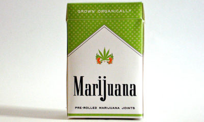 A pack of joints packaged too look like Marlboro cigarette packs. Pack is green with the word Marijuana stamped on front