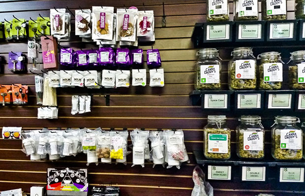 Bud and products on the shelves of the Canna Daddy's Dispensary
