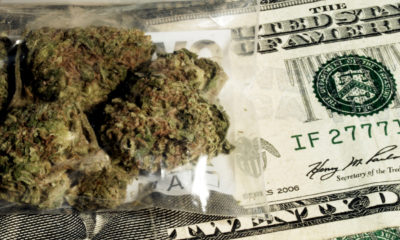 A five dollar bill is exchanged for a small bag of marijuana that has not been taxed due to an oversight in CO, resulting in less money for public schools.