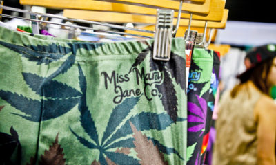 A rack of pot leggings with the branding Miss Mary Jane Co. at a store.