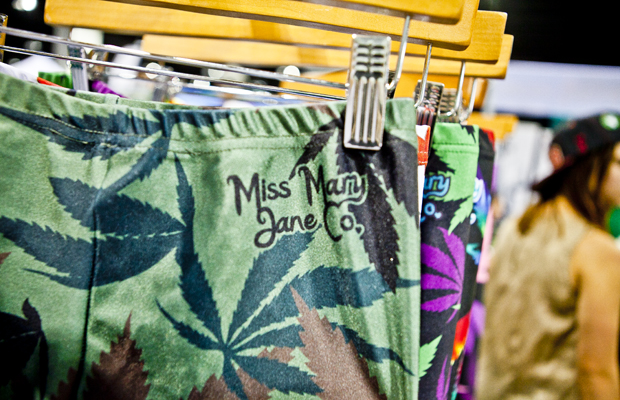A rack of pot leggings with the branding Miss Mary Jane Co. at a store.