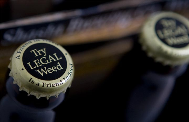A cap of a beer bottle says "Try LEGAL Weed."
