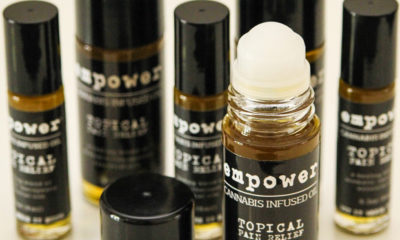 Bottles of roll on "Empower" Oil's displayed for sale as topical healing.