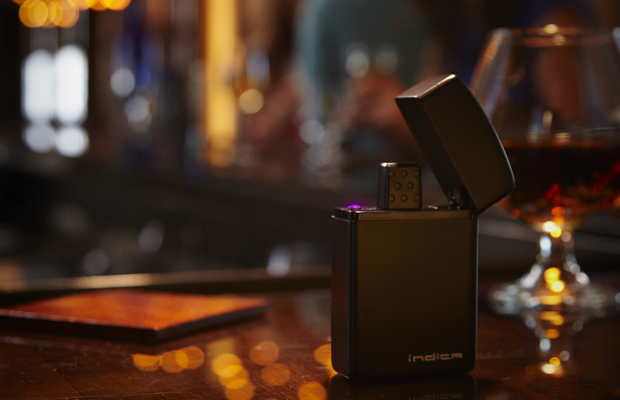 The discreet Indica Noir vaporizor sits on a bar posing as a Zippo lighter.