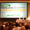 A projector welcomes people to the Marijuana Business Conference & Expo.