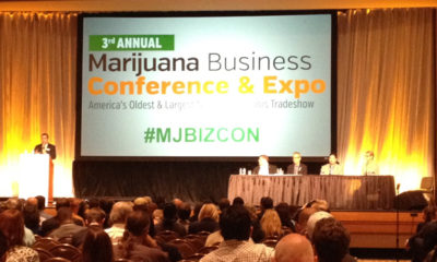 A projector welcomes people to the Marijuana Business Conference & Expo.