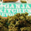A pile of buds and a card reading "Ganja Kitchen Revolution" calls people to elevate their edibles.