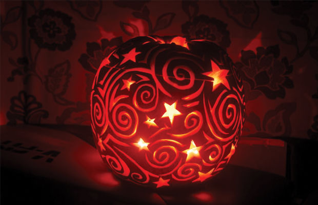 Pumpkin with Swirls and Stars Carved In