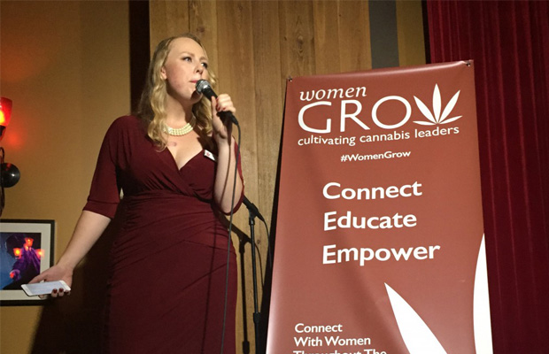 Speaker in Red Dress Talking at Women Grow Gala