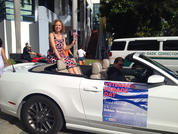 U.S. Congresswoman, Debbie Wasserman Shultz, Rides in a Convertible During a Veteran's Day Parade