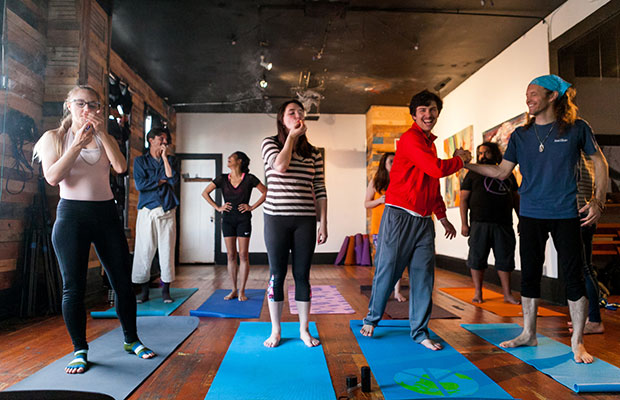 Participants Toke Up as They Prepare for a Yoga Session