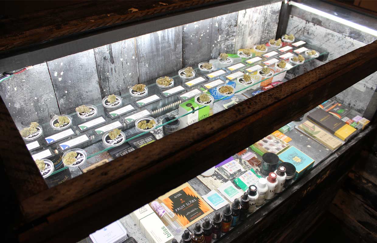 A cabinet displays different strains available at the Buds and Roses dispensary in California.